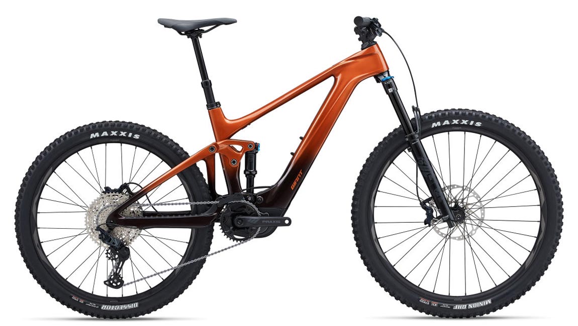 Giant brand e-bike in an amber-orange color.